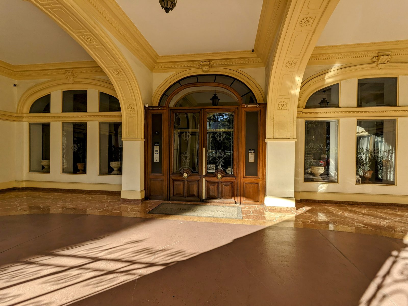 The wood and etched-glass entrance door of Le Grand Hôtel, avenue Félix Faure in Nice