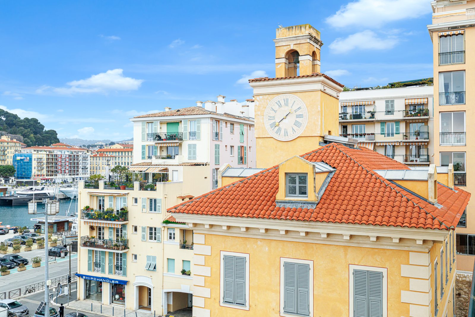 The clock building on the quay of the port of Nice, seen from Le Neptune