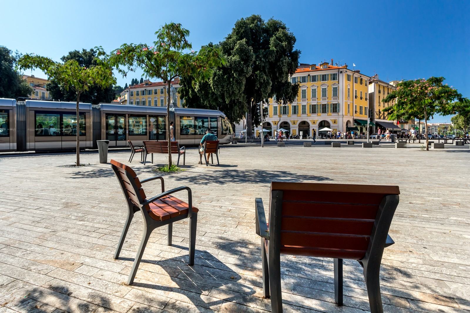 The tram and benches on place Garibaldi, at the entrance to Old Nice